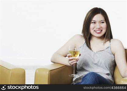 Close-up of a young woman holding a wineglass