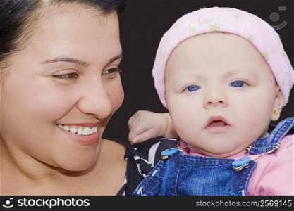 Close-up of a young woman holding her son