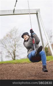 Close-up of a young woman in a zipline