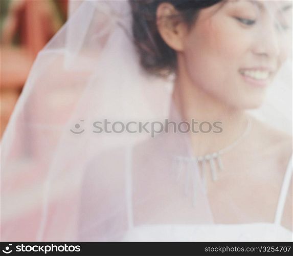 Close-up of a young woman in the wedding dress