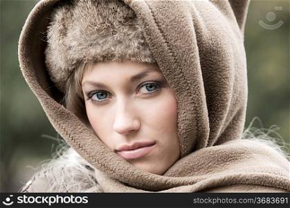 close up of a young woman in winter season with head scarf