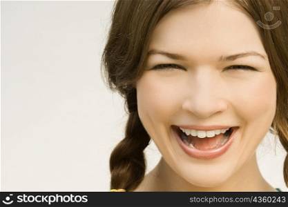 Close-up of a young woman laughing