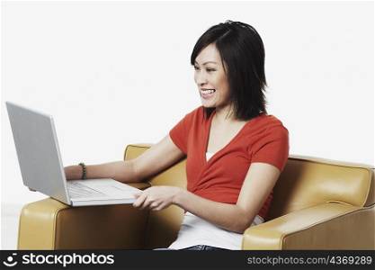 Close-up of a young woman looking at a laptop