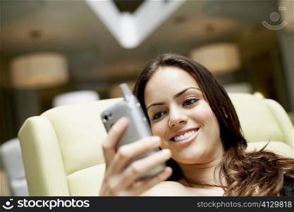 Close-up of a young woman looking at a mobile phone