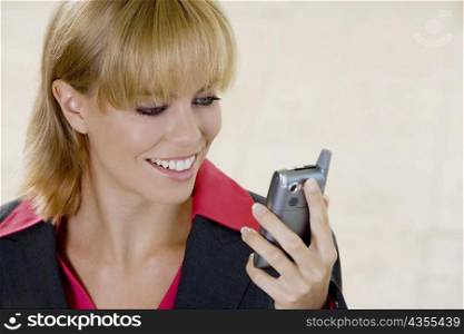 Close-up of a young woman looking at a mobile phone