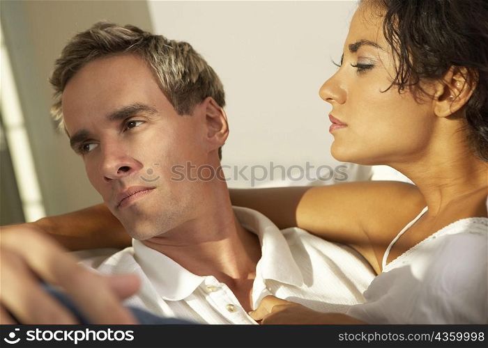 Close-up of a young woman looking at a young man