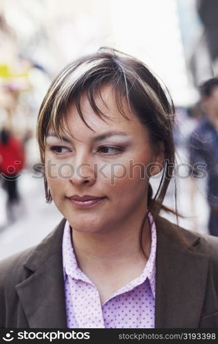 Close-up of a young woman looking away