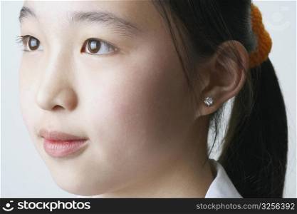 Close-up of a young woman looking away