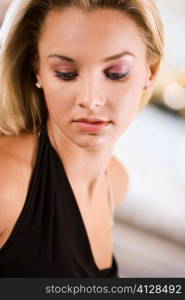 Close-up of a young woman looking down