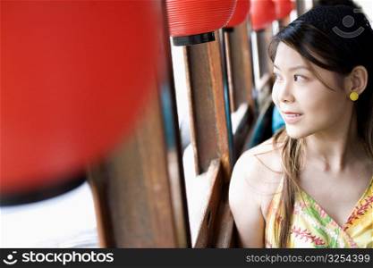 Close-up of a young woman looking out the window of a tourboat