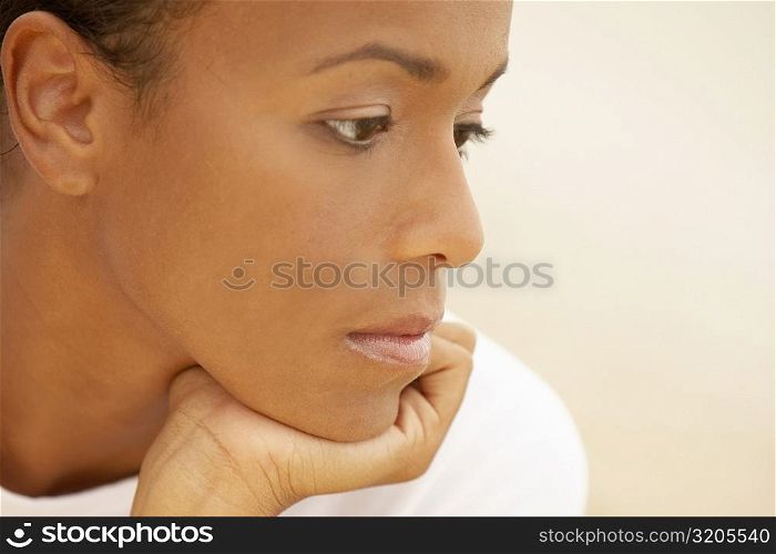 Close-up of a young woman looking sad
