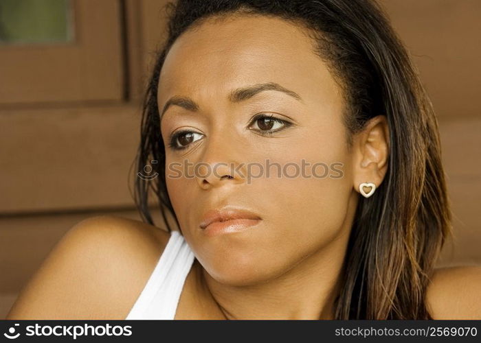 Close-up of a young woman looking serious