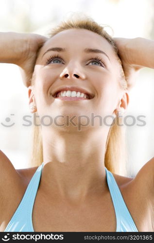 Close-up of a young woman looking up