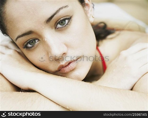 Close-up of a young woman lying down