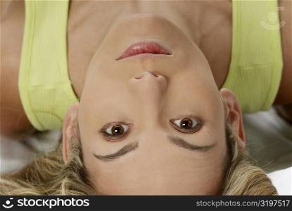 Close-up of a young woman lying down