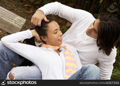 Close-up of a young woman lying on a young man&acute;s lap