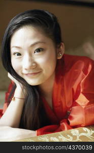 Close-up of a young woman lying on the bed