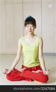 Close-up of a young woman meditating