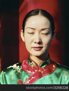 Close-up of a young woman meditating with her eyes closed