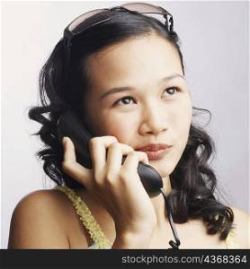 Close-up of a young woman on the phone