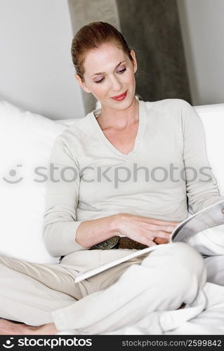 Close-up of a young woman reading a book