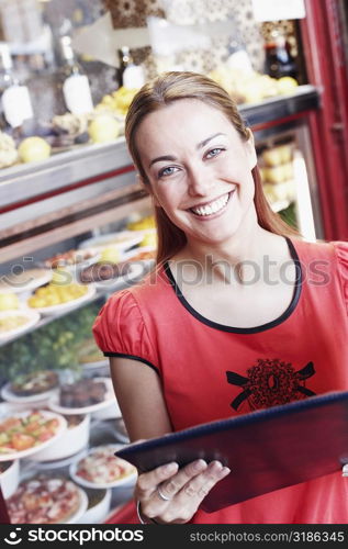 Close-up of a young woman reading a menu in a restaurant