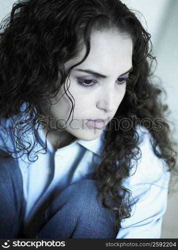 Close-up of a young woman sitting