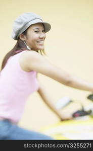 Close-up of a young woman sitting on a motorcycle