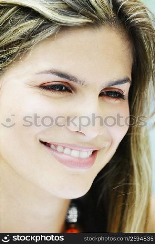 Close-up of a young woman smiling
