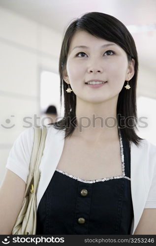 Close-up of a young woman smiling