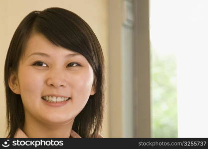 Close-up of a young woman smiling