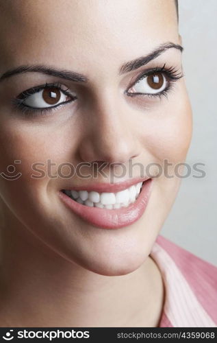 Close-up of a young woman smiling