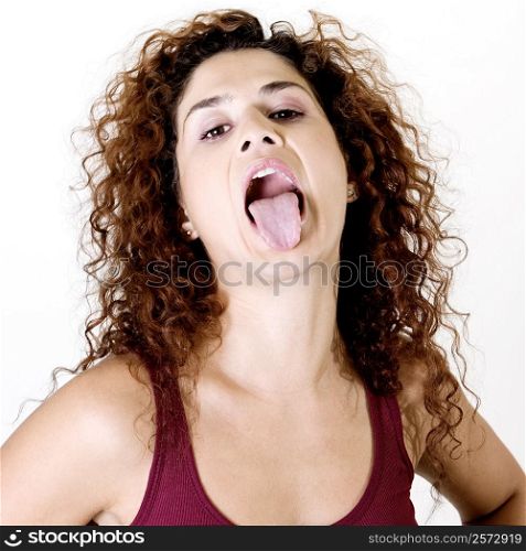 Close-up of a young woman sticking out her tongue