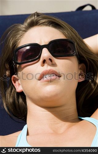Close-up of a young woman sunbathing