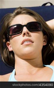 Close-up of a young woman sunbathing