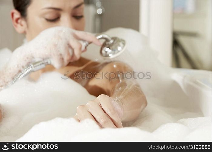 Close-up of a young woman taking a shower
