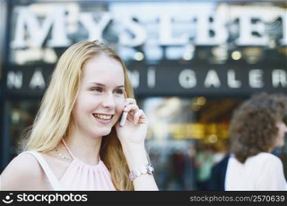 Close-up of a young woman talking on a mobile phone