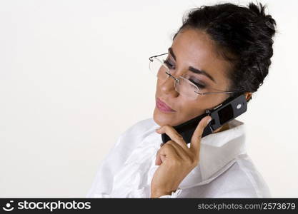 Close-up of a young woman talking on a mobile phone