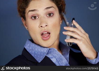 Close-up of a young woman talking on a mobile phone