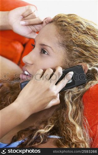 Close-up of a young woman talking on a mobile phone