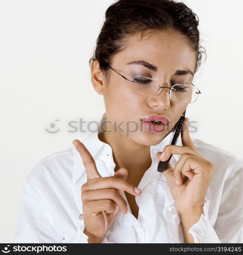 Close-up of a young woman talking on a mobile phone