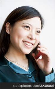 Close-up of a young woman talking on mobile phone