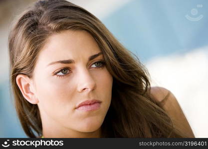 Close-up of a young woman thinking