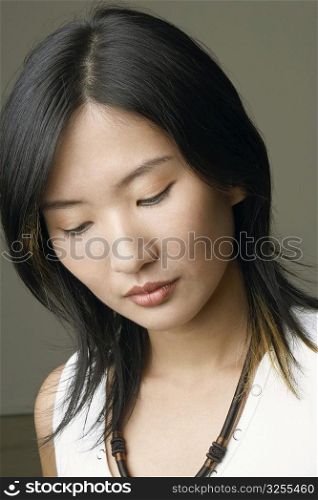 Close-up of a young woman thinking
