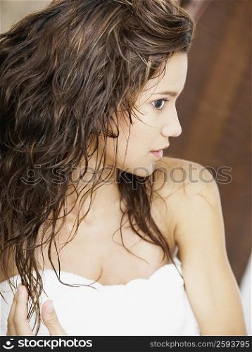 Close-up of a young woman touching her hair