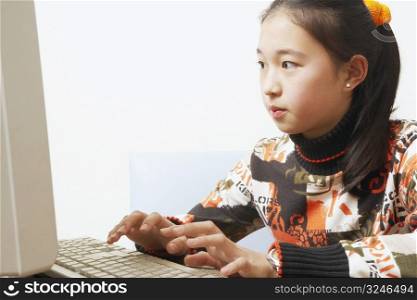 Close-up of a young woman using a computer