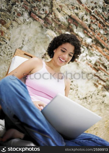 Close-up of a young woman using a laptop