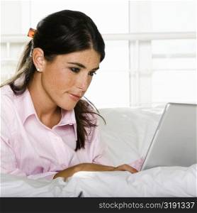 Close-up of a young woman using a laptop