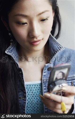 Close-up of a young woman using a mobile phone