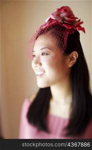 Close-up of a young woman wearing a headdress